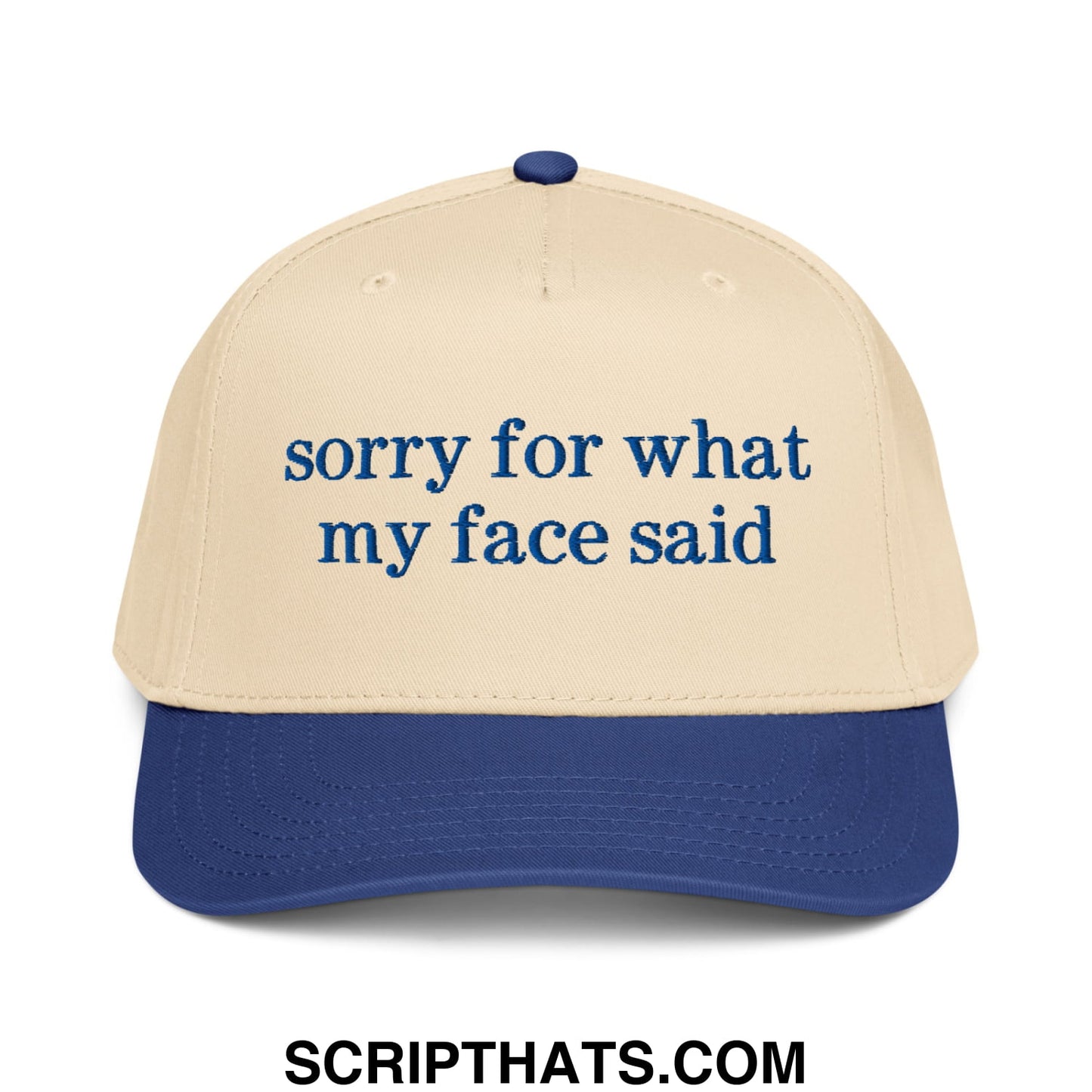 Beige and navy blue baseball snapback hat with dark blue embroidered sorry for what my face said script text