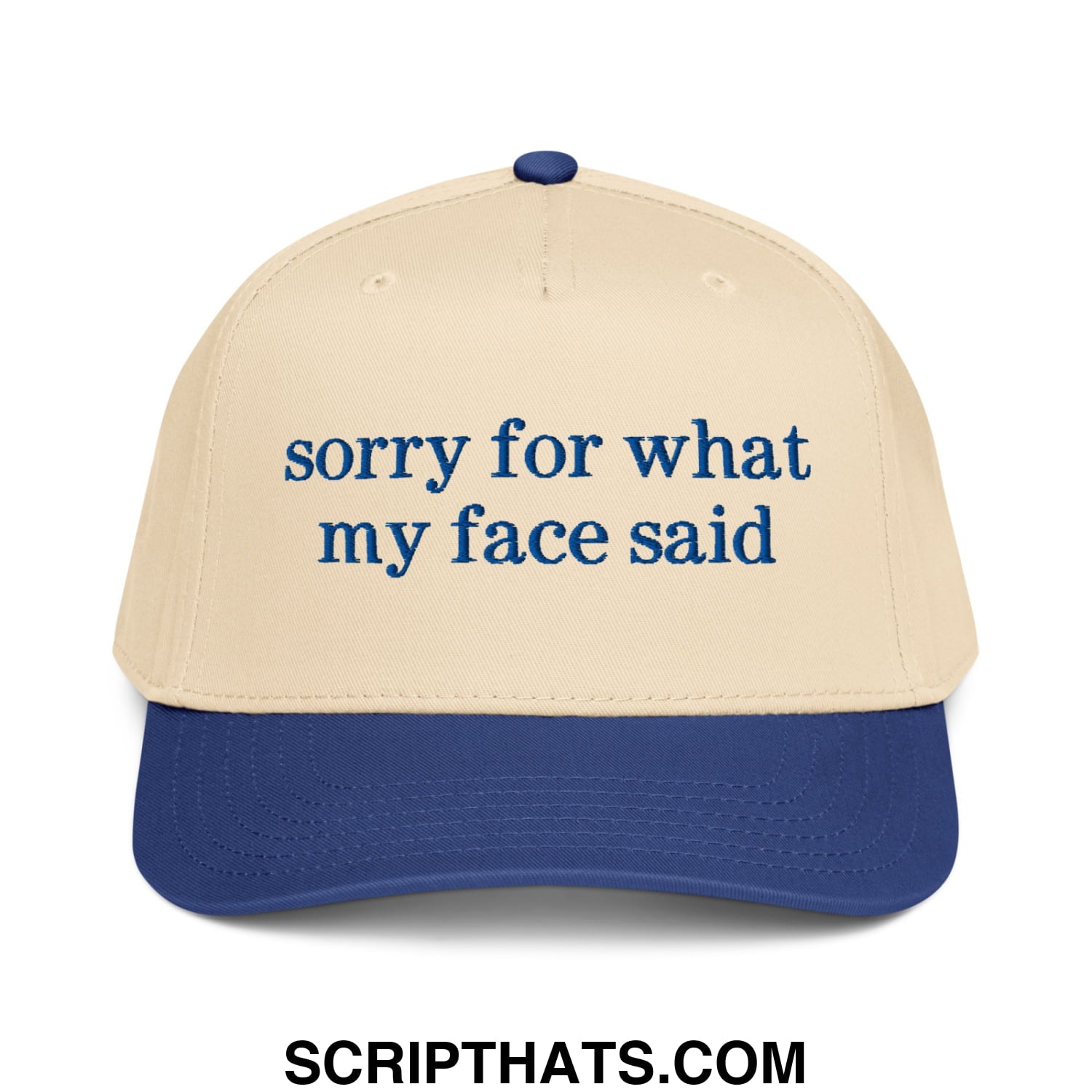 Beige and navy blue baseball snapback hat with dark blue embroidered sorry for what my face said script text