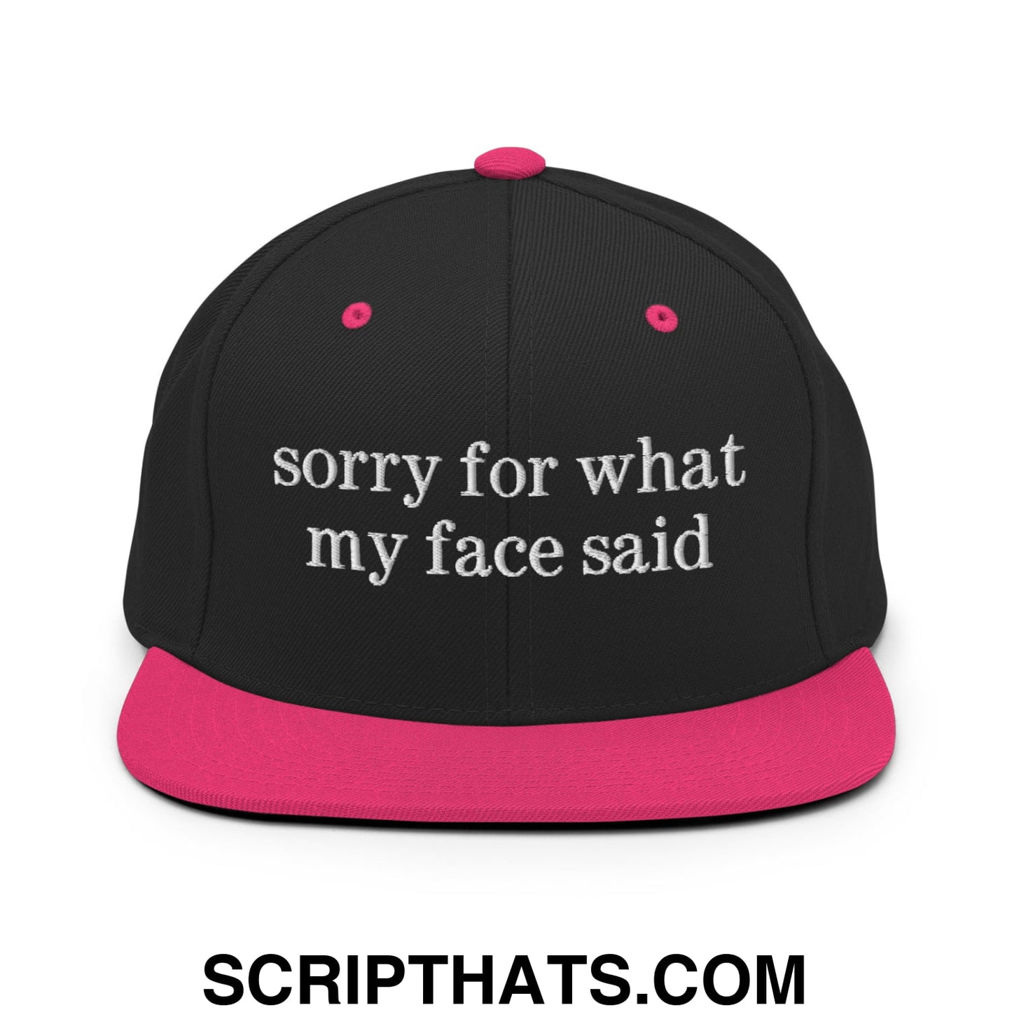 Black snapback cap with vibrant pink brim and button featuring white embroidered sorry for what my face said text