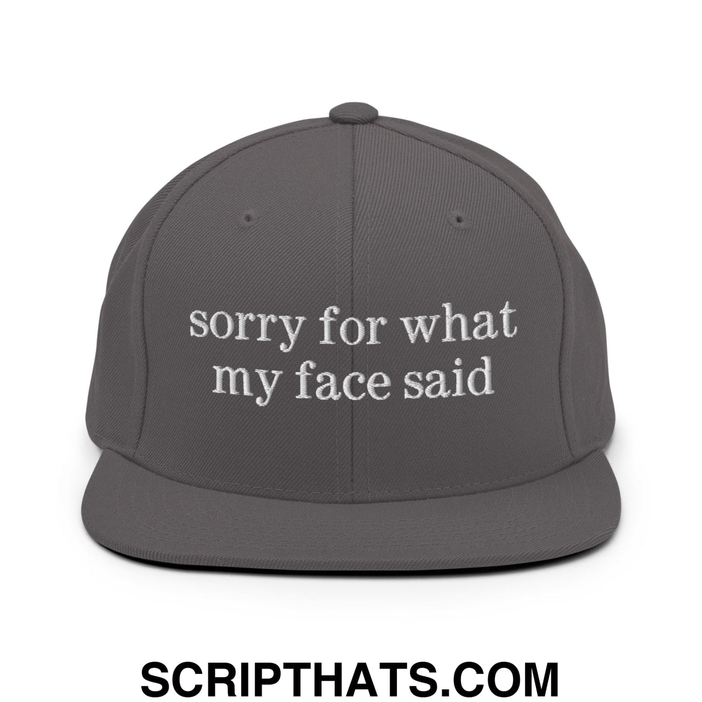 Dark gray flat bill snapback hat with white embroidered sorry for what my face said text on the front