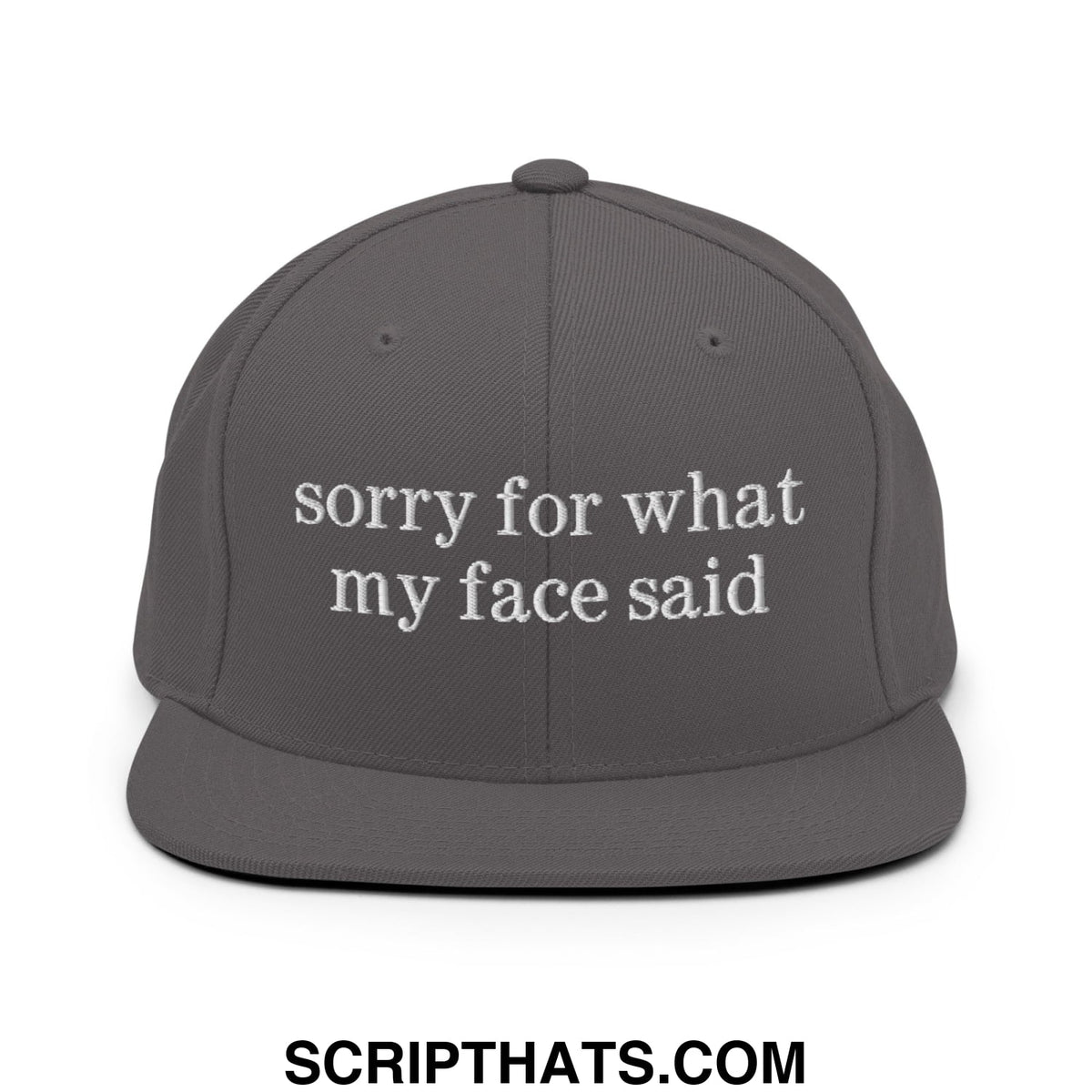 Dark gray flat bill snapback hat with white embroidered sorry for what my face said text on the front