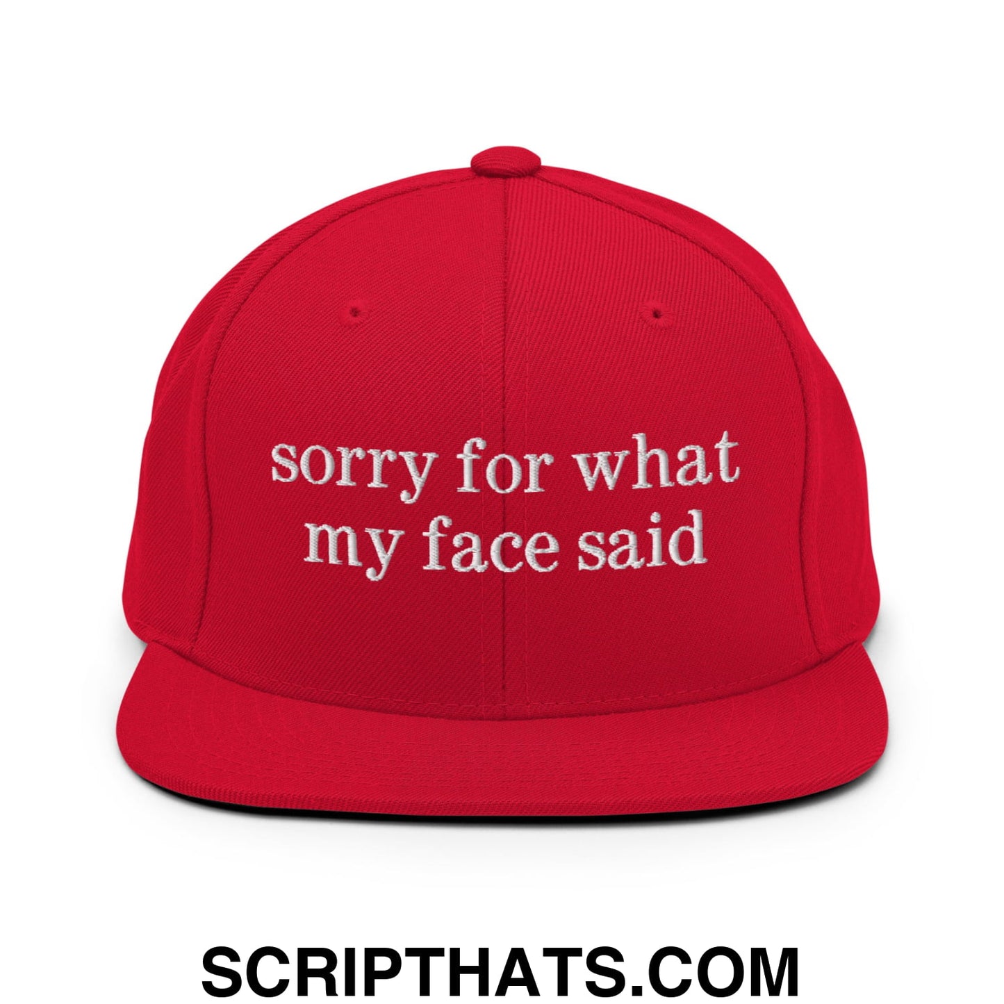 Red snapback hat with white embroidered sorry for what my face said text and flat bill brim design