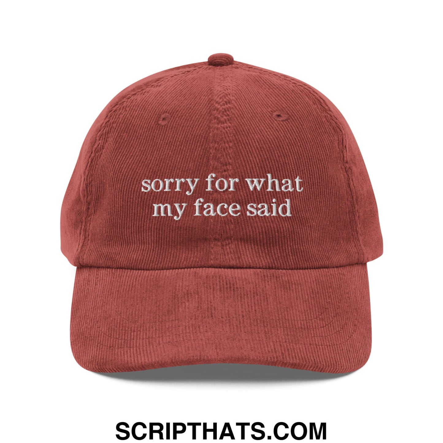 Rust-colored corduroy dad hat with unstructured fit and white embroidered sorry for what my face said text