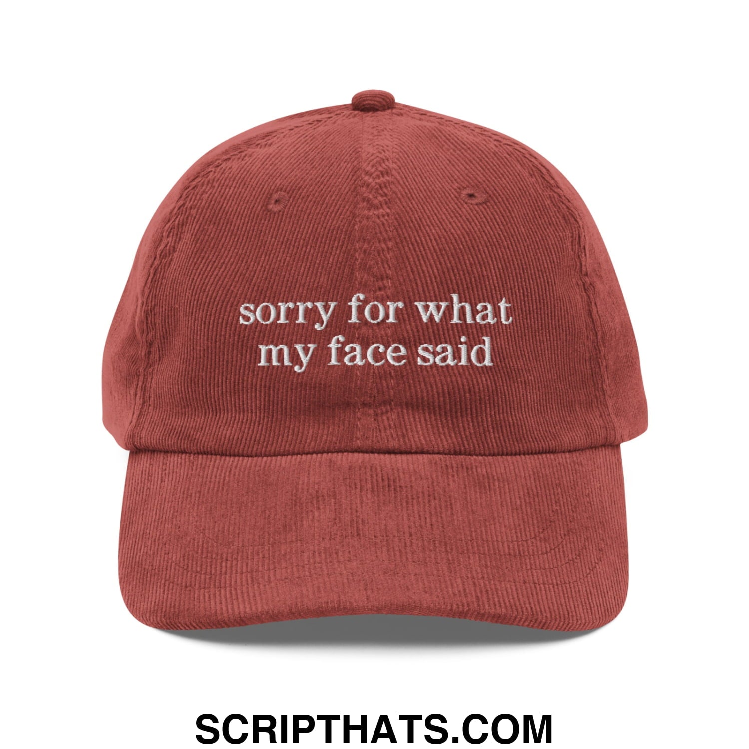 Rust-colored corduroy dad hat with unstructured fit and white embroidered sorry for what my face said text