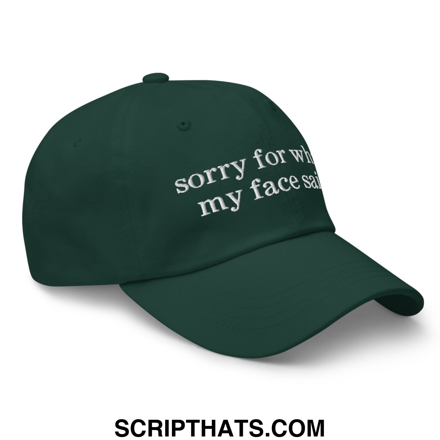 Dark green unstructured dad hat with white embroidered text sorry for what my face said on front panel