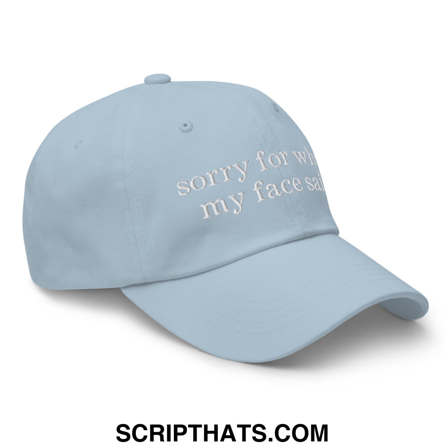 Light blue unstructured dad hat with white embroidered sorry for what my face said text on front panel