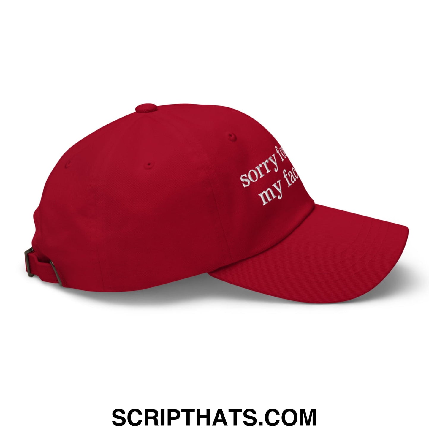 Red embroidered unstructured dad hat with sorry for my face text on the side perfect for casual wear