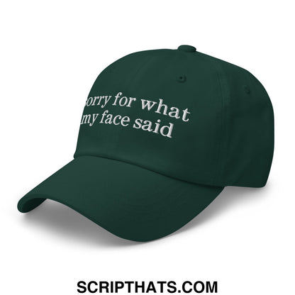 Dark green embroidered unstructured dad hat with white sorry for what my face said text on front panel
