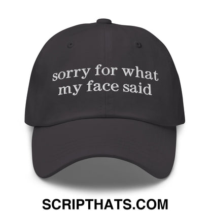 Black embroidered sorry for what my face said text on an unstructured dad hat baseball cap
