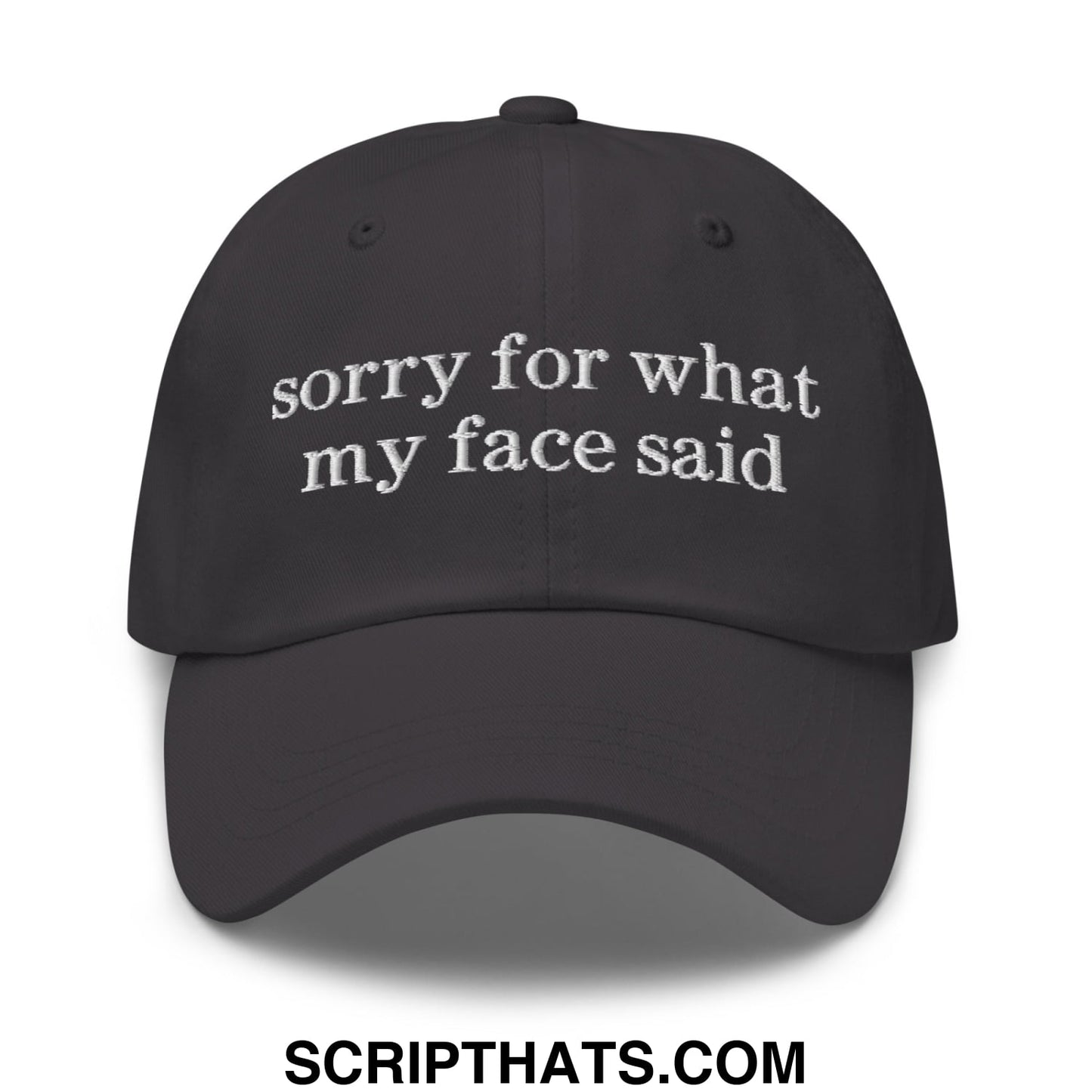 Black embroidered sorry for what my face said text on an unstructured dad hat baseball cap