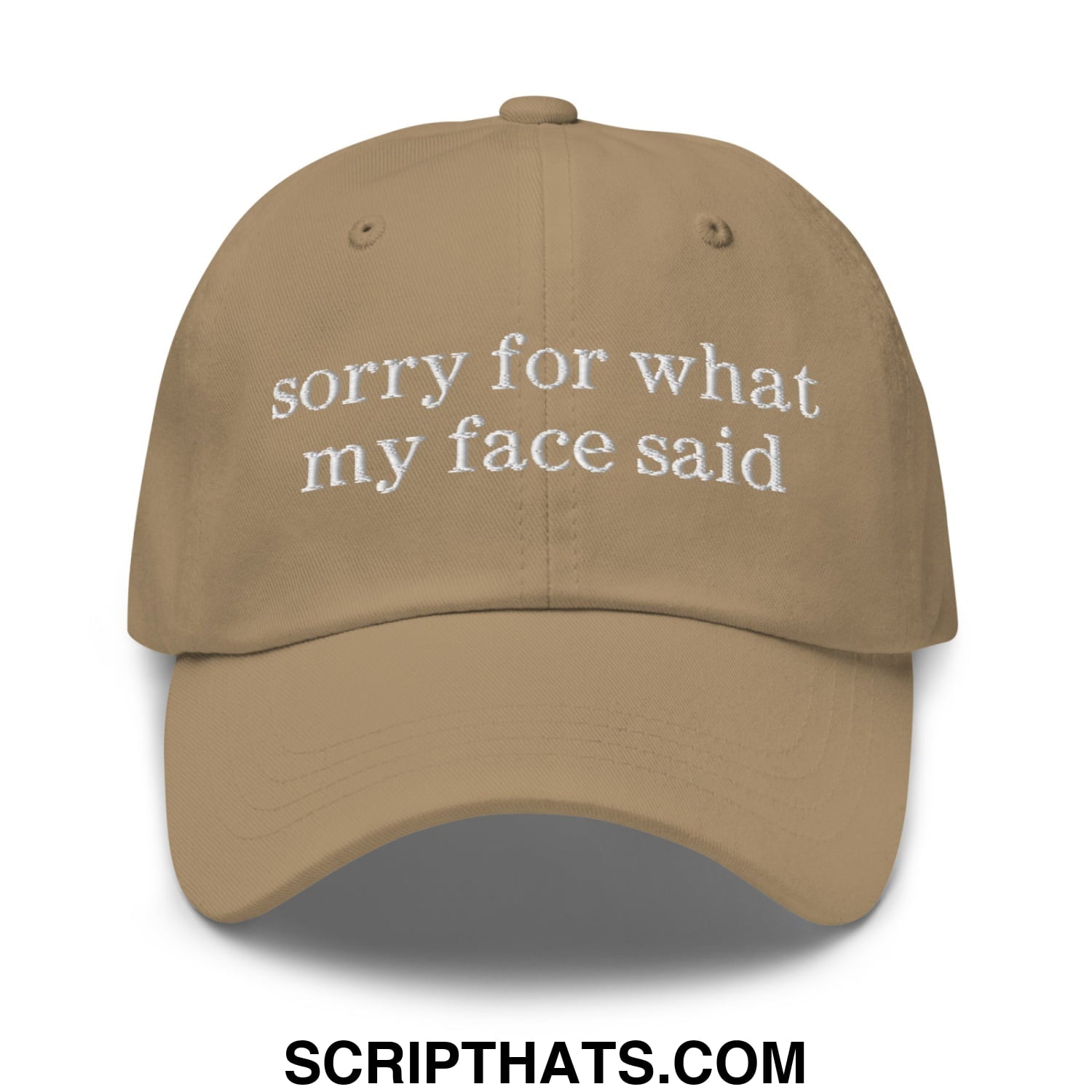 Tan unstructured dad hat with white embroidered sorry for what my face said text on the front