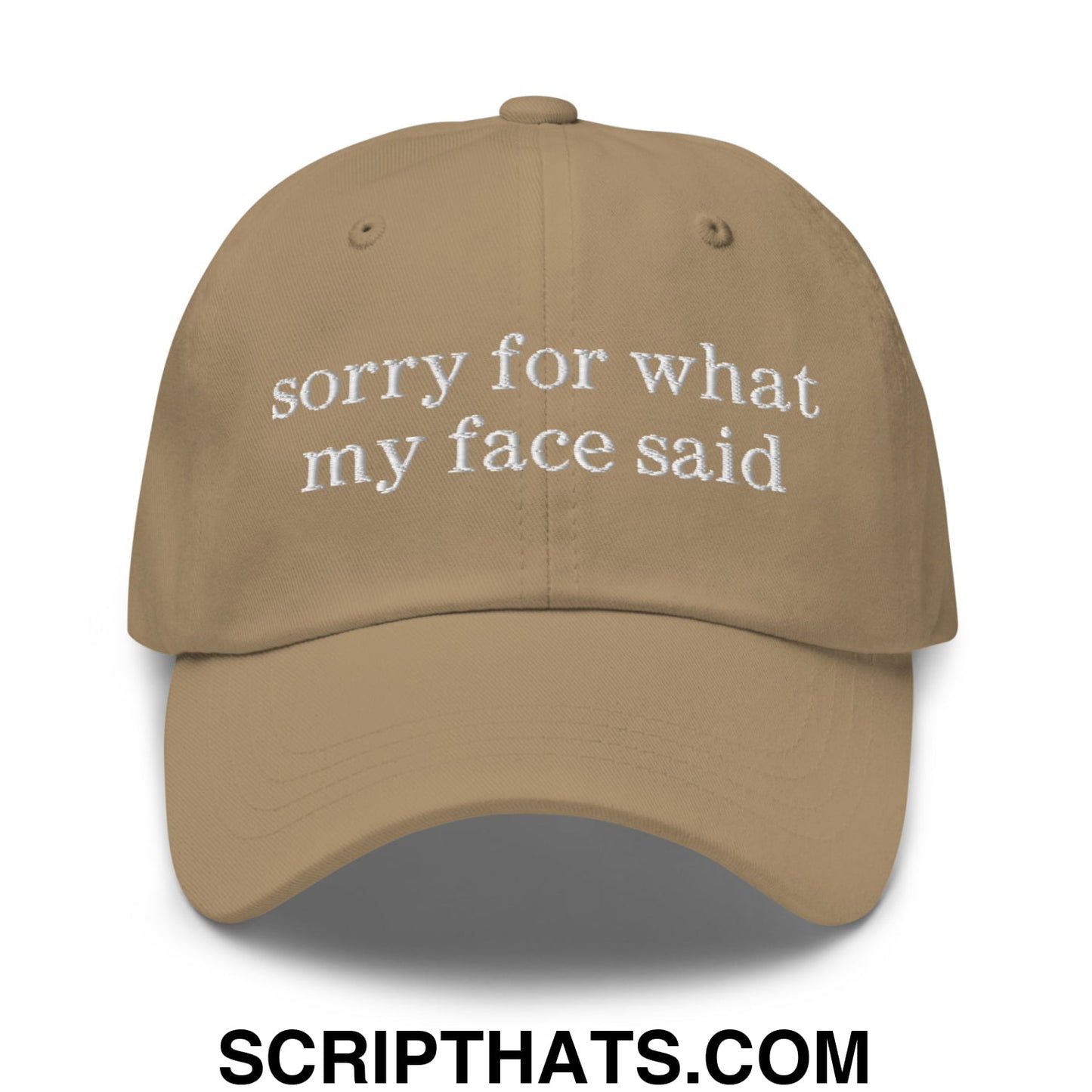 Tan unstructured dad hat with white embroidered sorry for what my face said text on the front