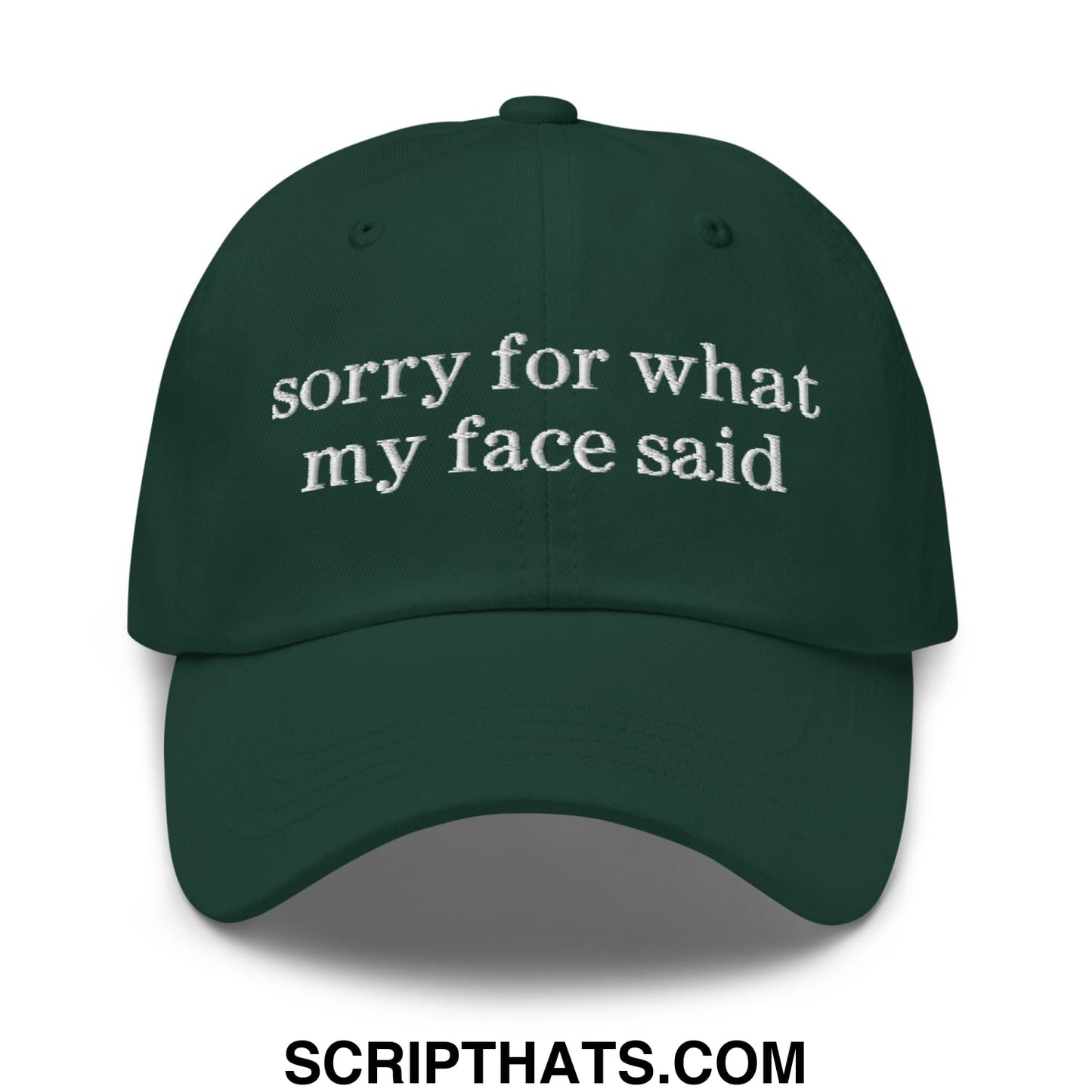 Dark green embroidered unstructured dad hat with white sorry for what my face said text on front panel
