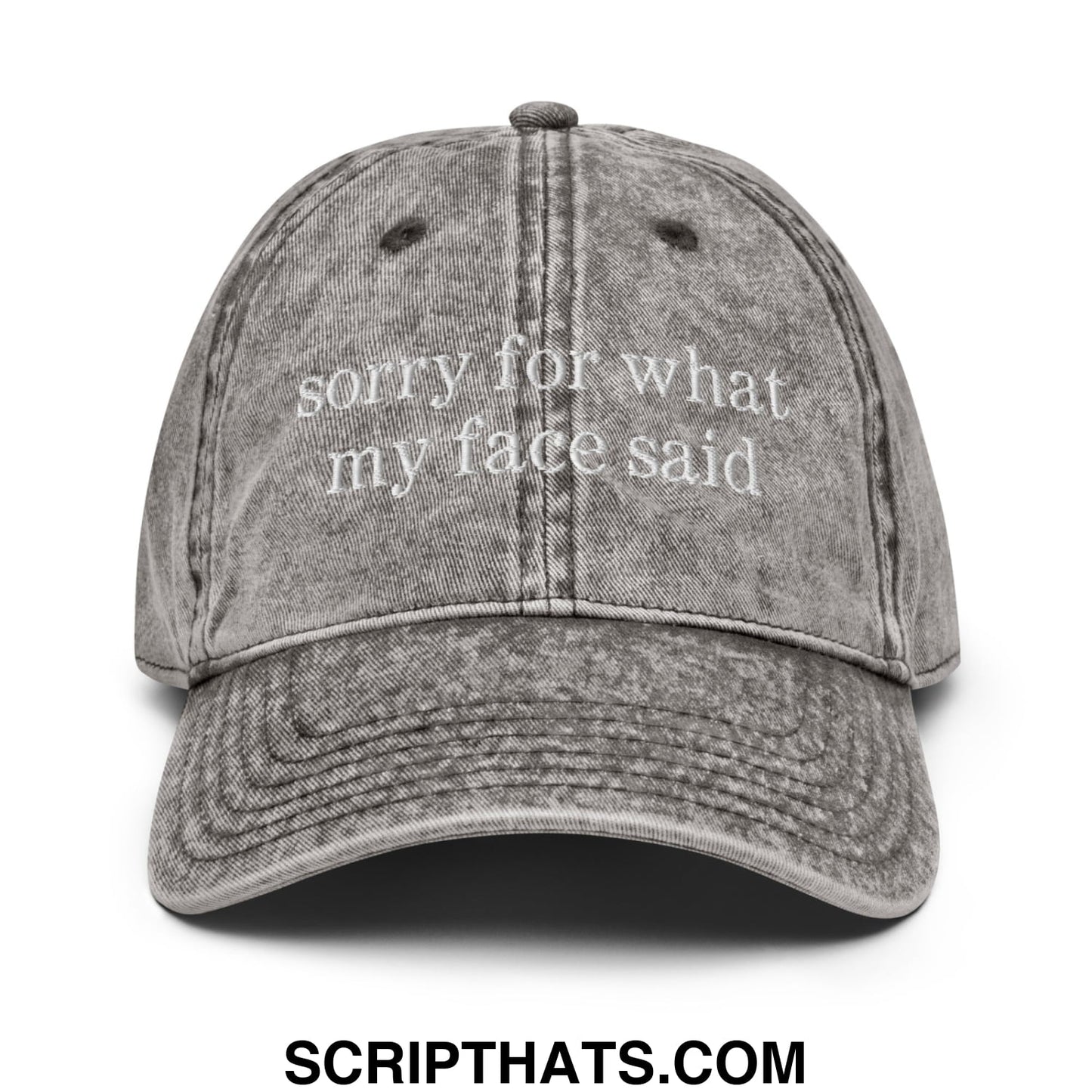A faded gray denim dad hat with white embroidered sorry for what my face said text unstructured design
