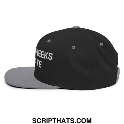 Black snapback cap with gray brim and button featuring white embroidered cheeks text side spread cheeks not hate hat