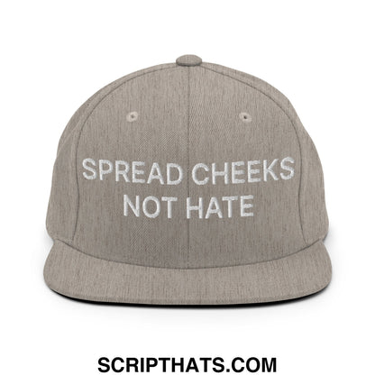 A gray snapback hat with white embroidered spread cheeks not hate text and a flat bill brim design