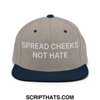 A gray and navy blue embroidered flat bill snapback hat with white text spread cheeks not hate