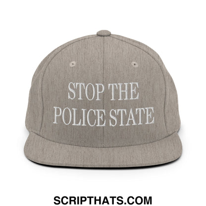Gray snapback hat with white embroidered stop the police state text and flat bill brim for streetwear style