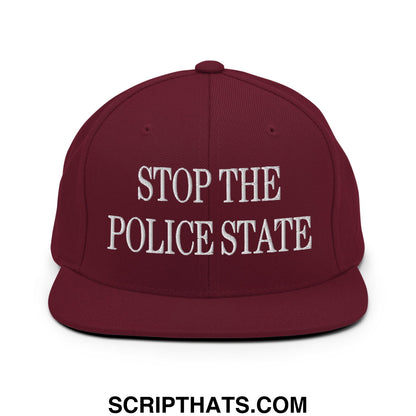 Maroon snapback cap with white embroidered stop the police state text and flat bill brim design