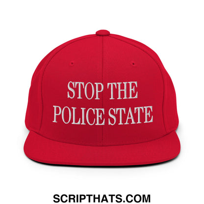 Red snapback cap with white embroidered stop the police state text and flat bill brim in a streetwear style
