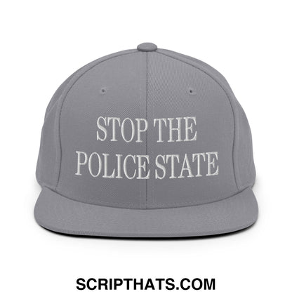 Gray flat bill snapback hat featuring white embroidered stop the police state text on the front panel