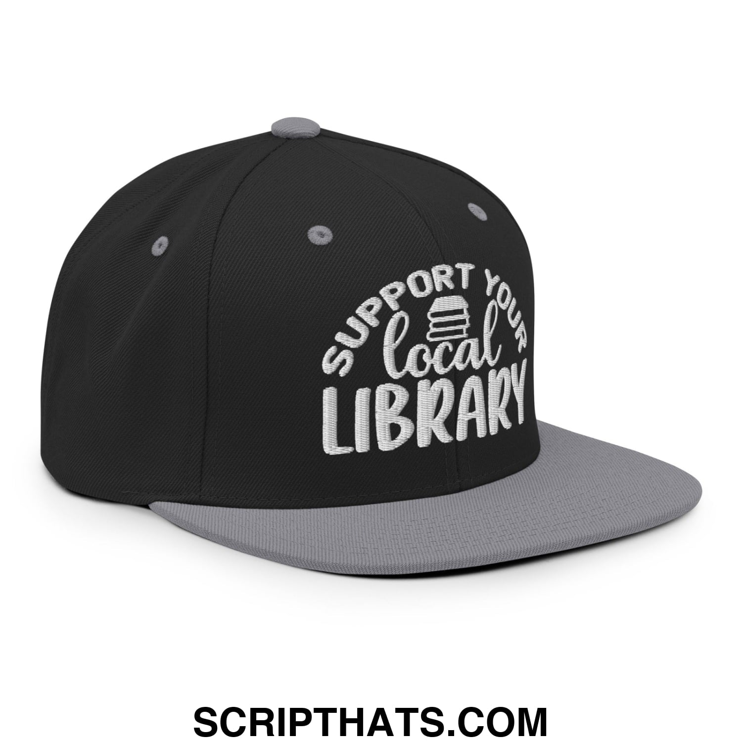 Black and gray snapback hat with white embroidered support your local library text and stack of books graphic