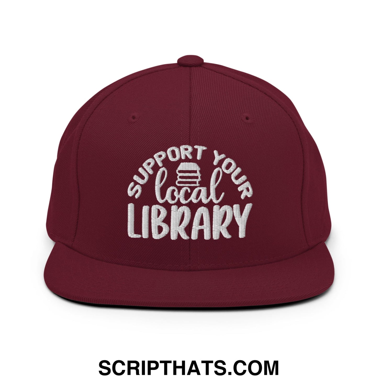 Maroon snapback hat with white embroidered support your local library text and stack of books graphic on the front