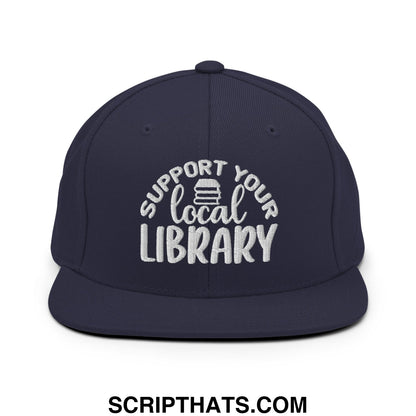 Navy blue snapback hat with white embroidered support your local library text and stack of books icon