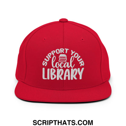 Red snapback hat with white embroidered support your local library text and stack of books icon flat bill brim