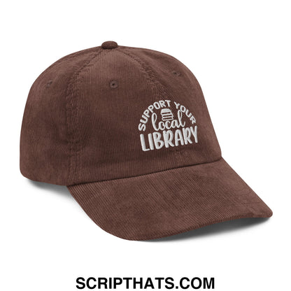Brown corduroy dad hat with white embroidered support your local library text and small book icon on front