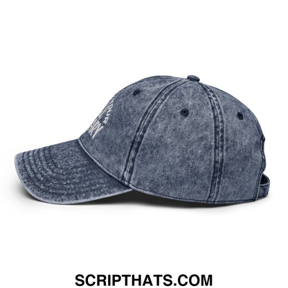 A faded blue denim dad hat with an unstructured fit and embroidered white support your local library text