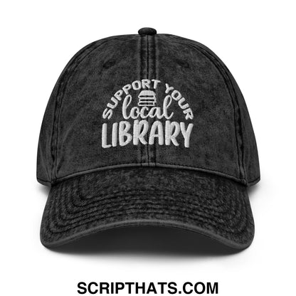 Black distressed denim dad hat with white embroidered support your local library text and book icon above local