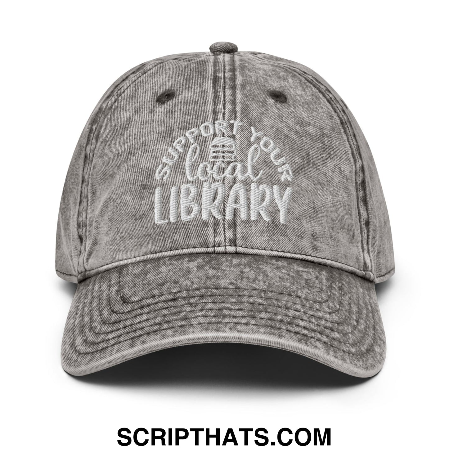 A faded gray unstructured denim dad hat with white embroidered text support your local library and a library icon