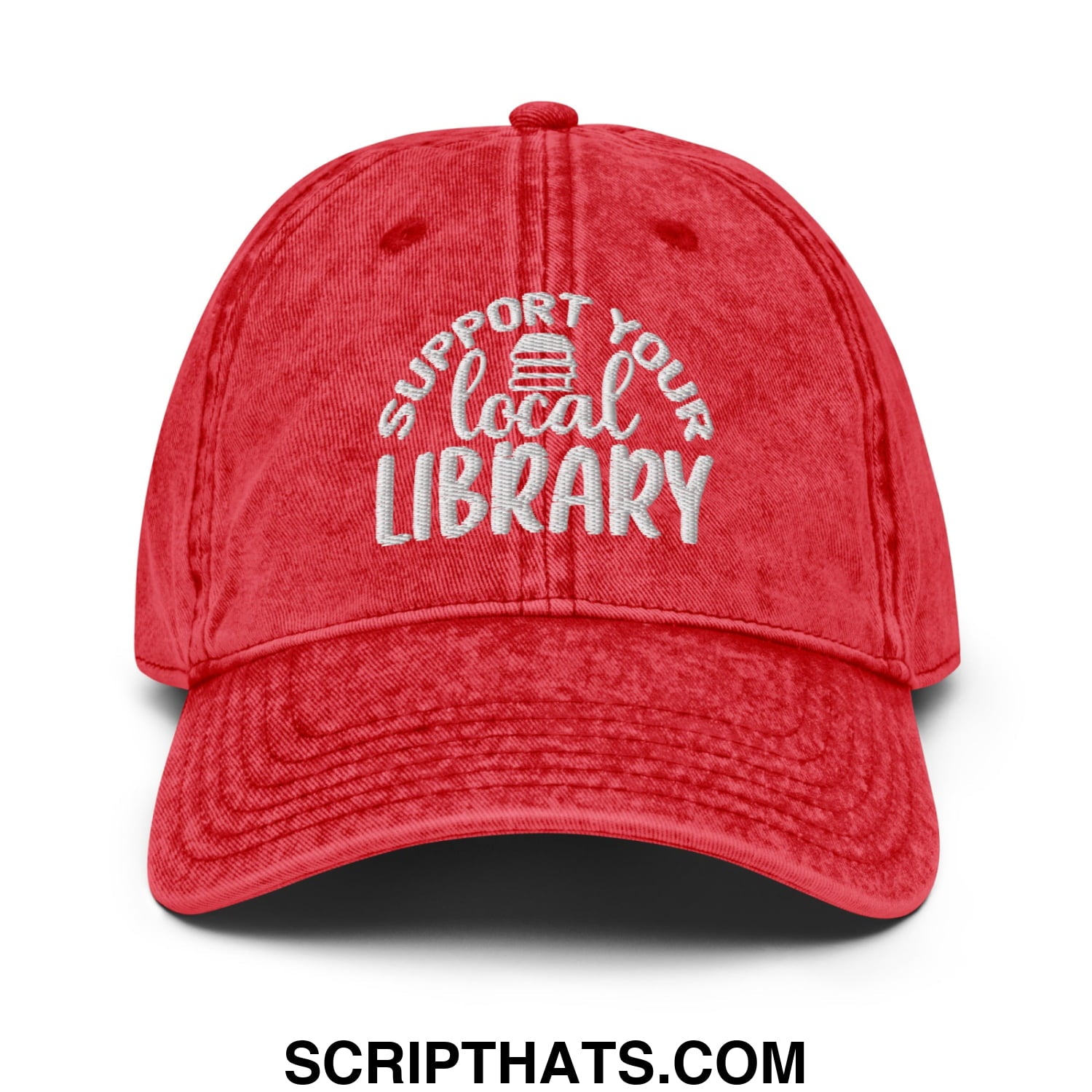 Red distressed cotton dad hat with white embroidered support your local library text and small book icon above local