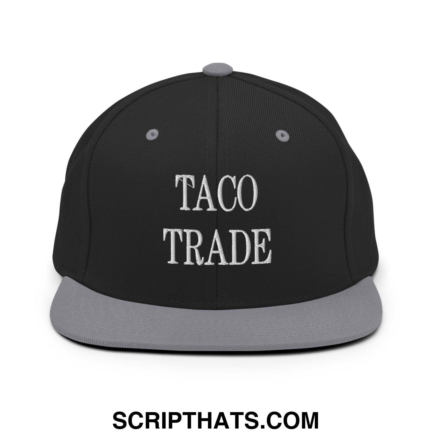 Black snapback cap with gray flat bill brim and white embroidered taco trade text in classic serif font