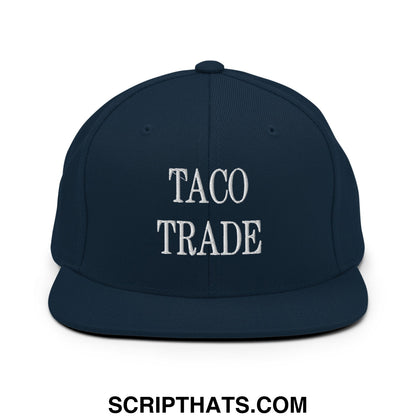 Navy blue snapback hat with white embroidered taco trade text and flat bill brim perfect for casual wear