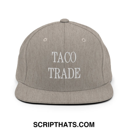 Gray flat bill snapback hat with white embroidered taco trade text on the front panel