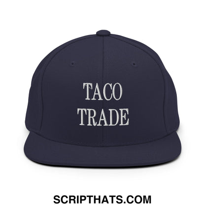 Navy blue snapback hat with white embroidered taco trade text and flat bill brim in cotton material