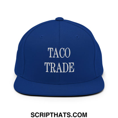 Royal blue snapback hat with white embroidered taco trade text and flat bill brim for casual wear