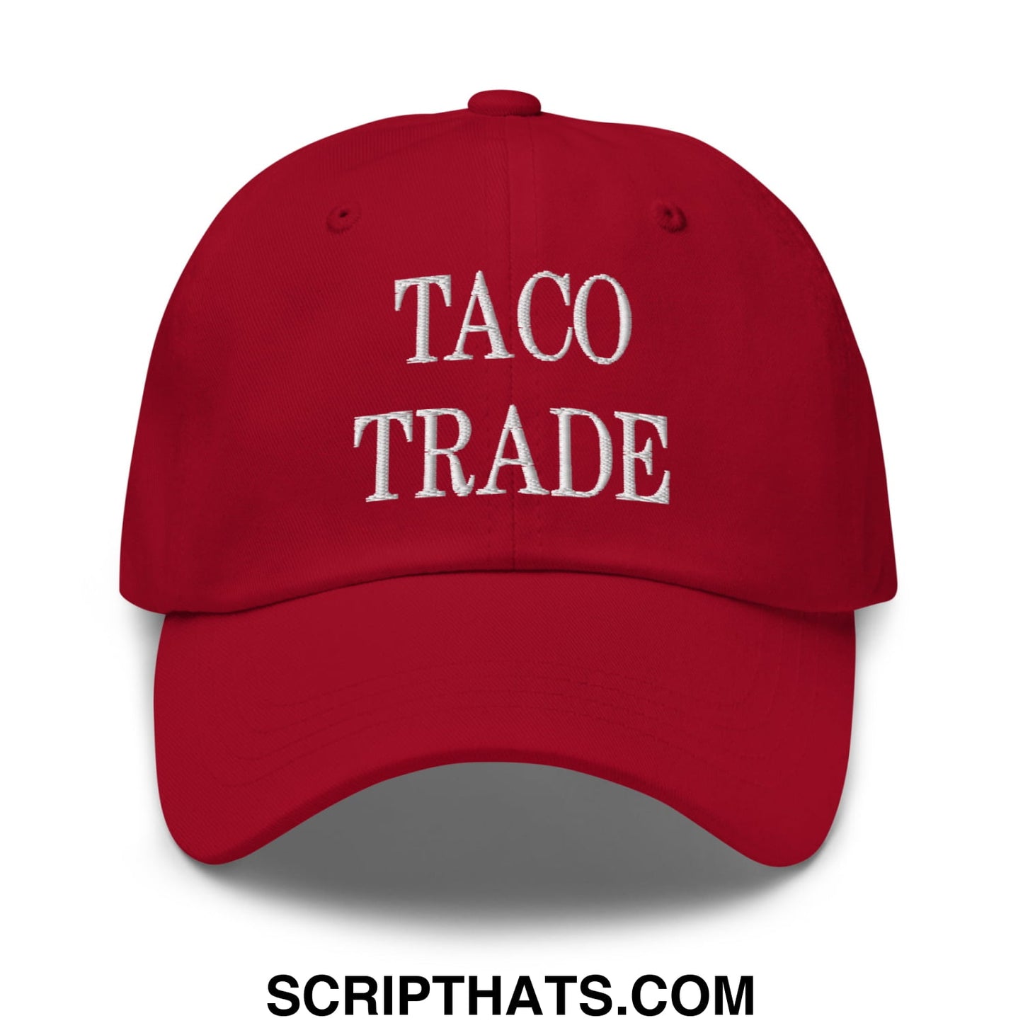 Red unstructured dad hat with taco trade embroidered in white thread across the front for casual wear