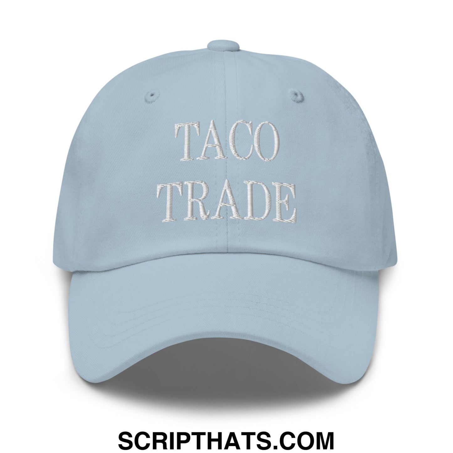Light blue unstructured dad hat with taco trade embroidered in white thread across the front for casual wear
