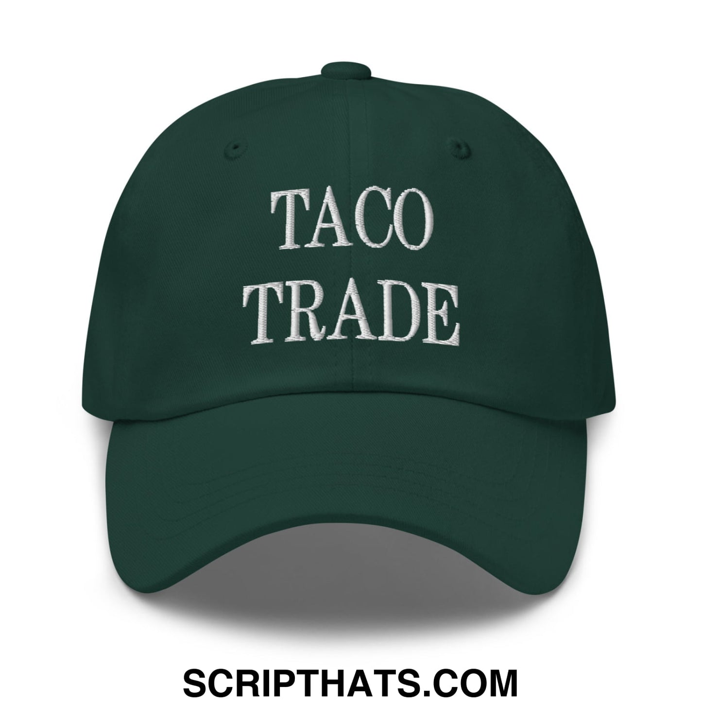 Dark green unstructured dad hat with taco trade embroidered in white thread across the front