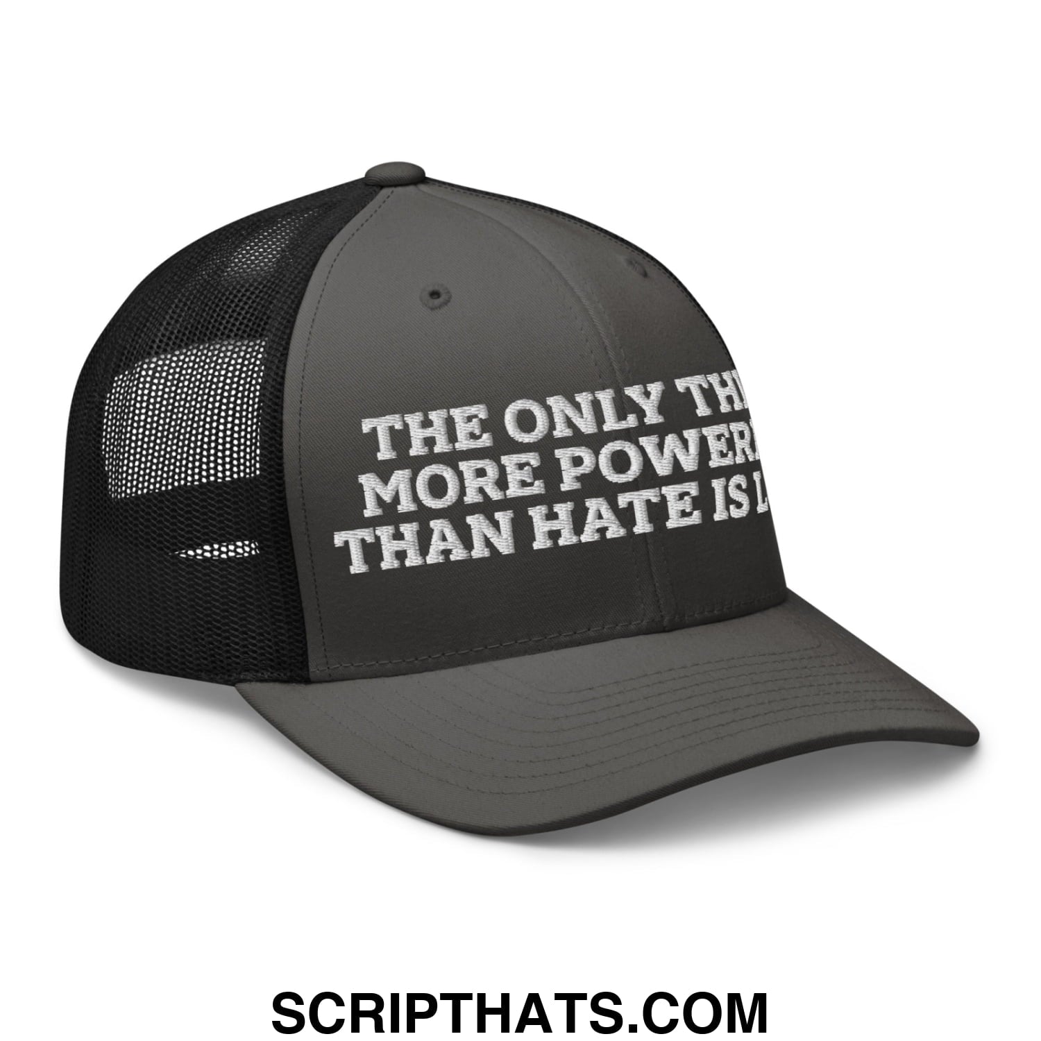 Black mesh trucker hat with white embroidered text saying the only thing more powerful than hate is love