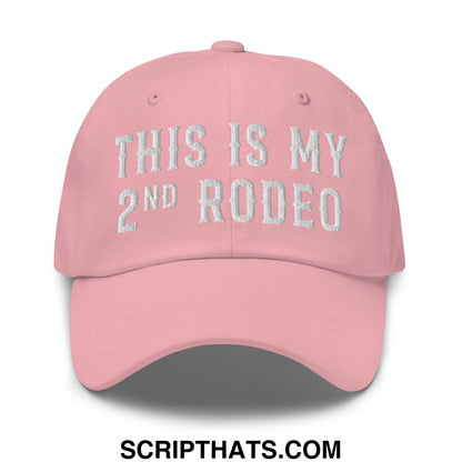 A soft pink unstructured dad hat with white embroidered text this is my 2nd rodeo called this is my second rodeo embroidered dad hat