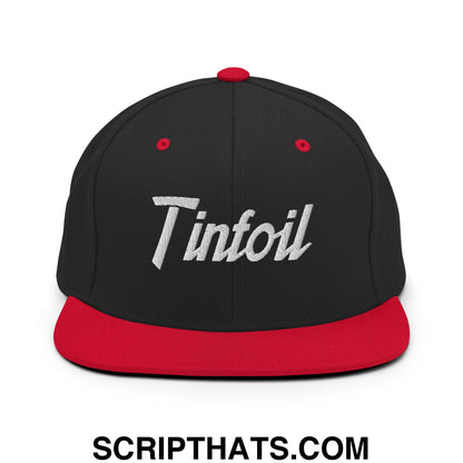 Black snapback cap with red brim and button featuring white embroidered tinfoil sports script on front