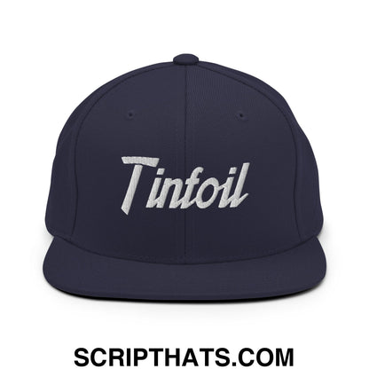 Navy blue snapback hat with white embroidered tinfoil sports script logo and flat bill brim for casual wear