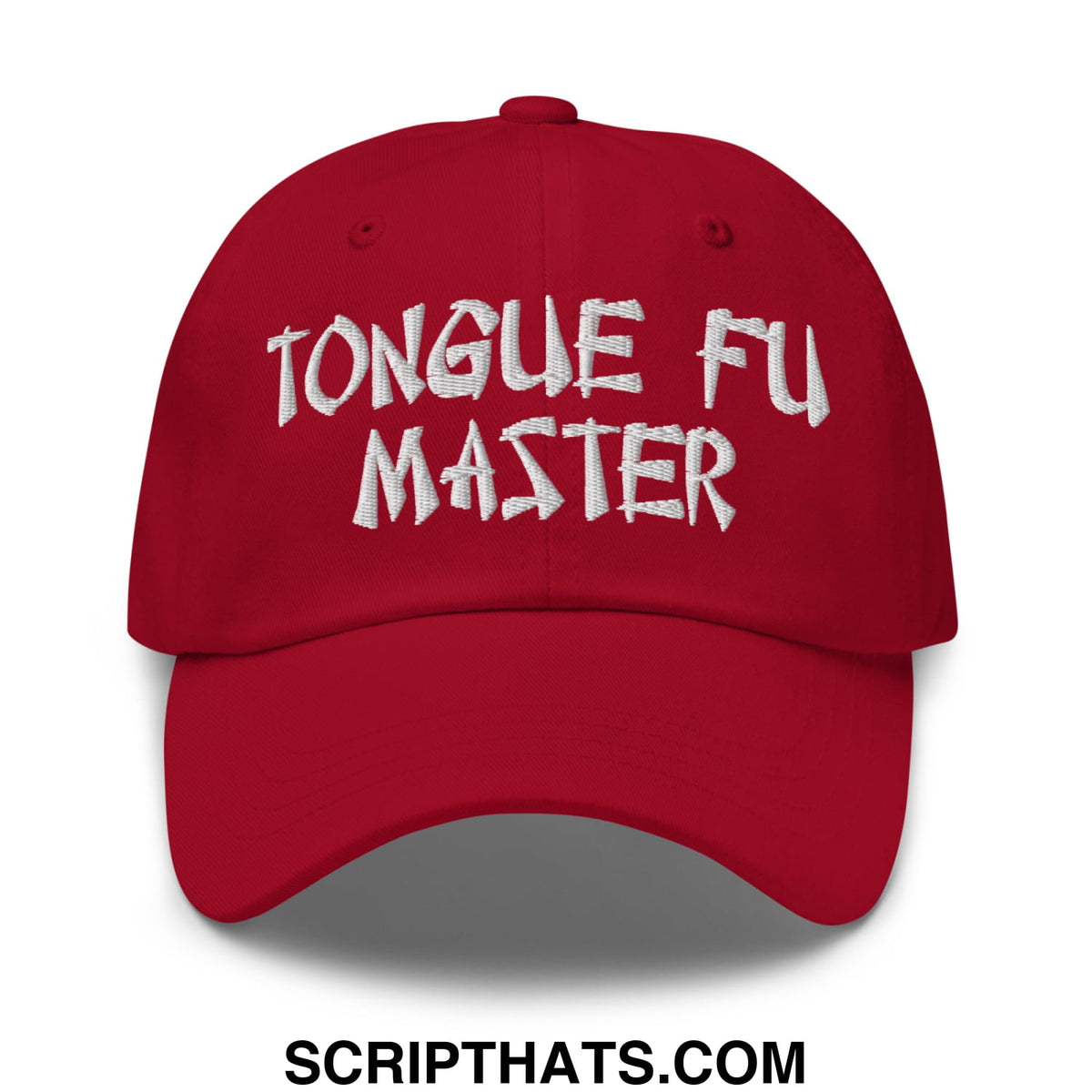 Red unstructured dad hat with white embroidered tongue fu master text perfect for casual wear