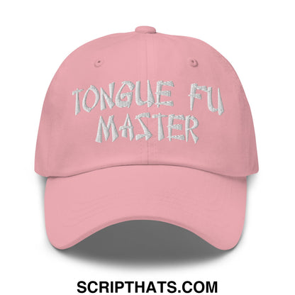 A soft pink unstructured dad hat with tongue fu master embroidered in textured silver thread on front