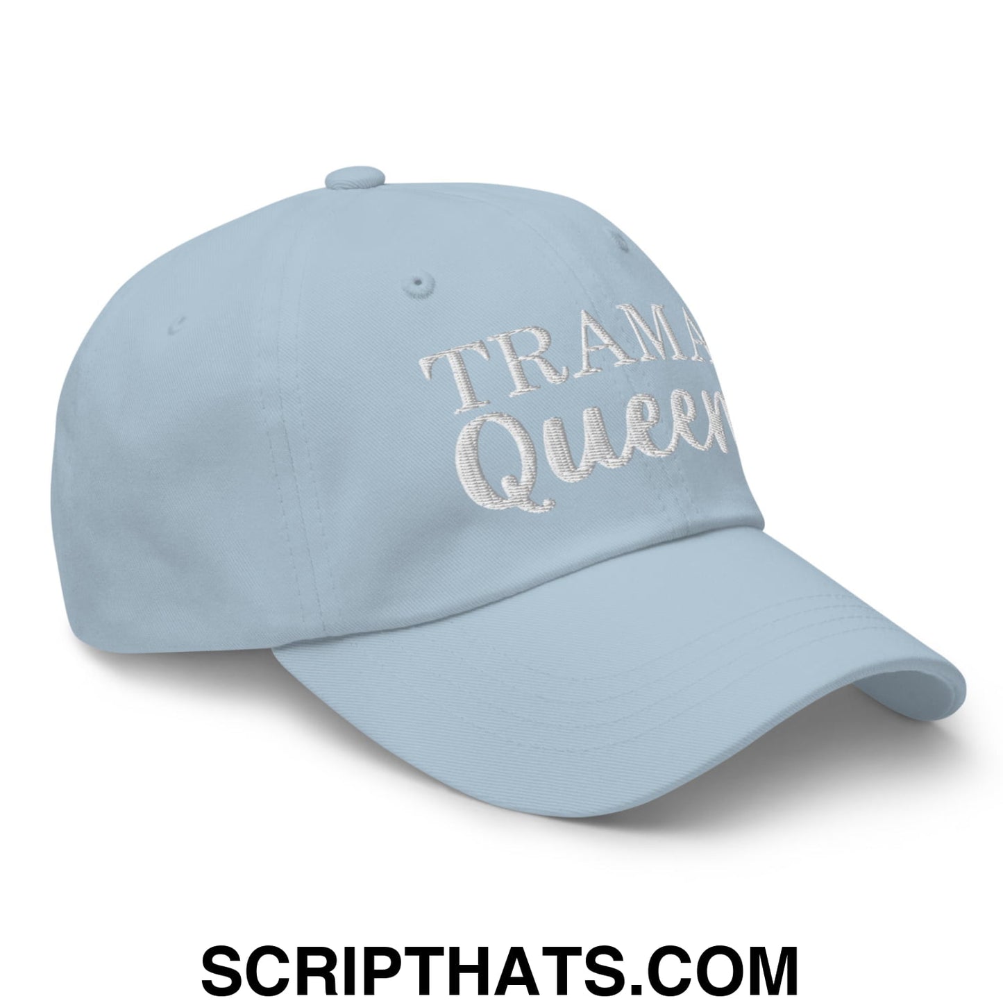 Light blue unstructured dad hat with trama queen embroidered in white thread on the front panel