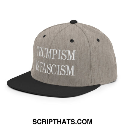 Gray and black snapback hat with white embroidered trumpism is fascism text and flat bill brim design
